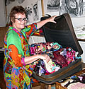 Lauren with suitcase of textiles